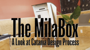 An artistic mailbox with words overtop reading "The MilaBox, A Look at Catania Design Process".
